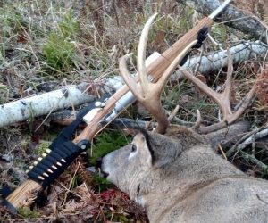 trophy-buck-posed-with-rifle