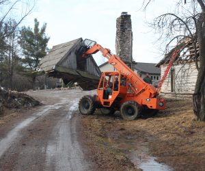 lift-equipment-carrying-away-a-section-of-roof