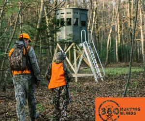 father-son-walking-to-their-360-deer-hunting-blind-with-rifles